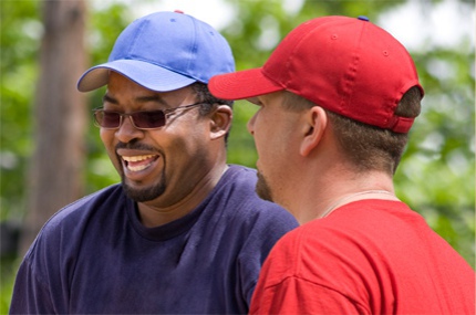 2 male veterans talking.